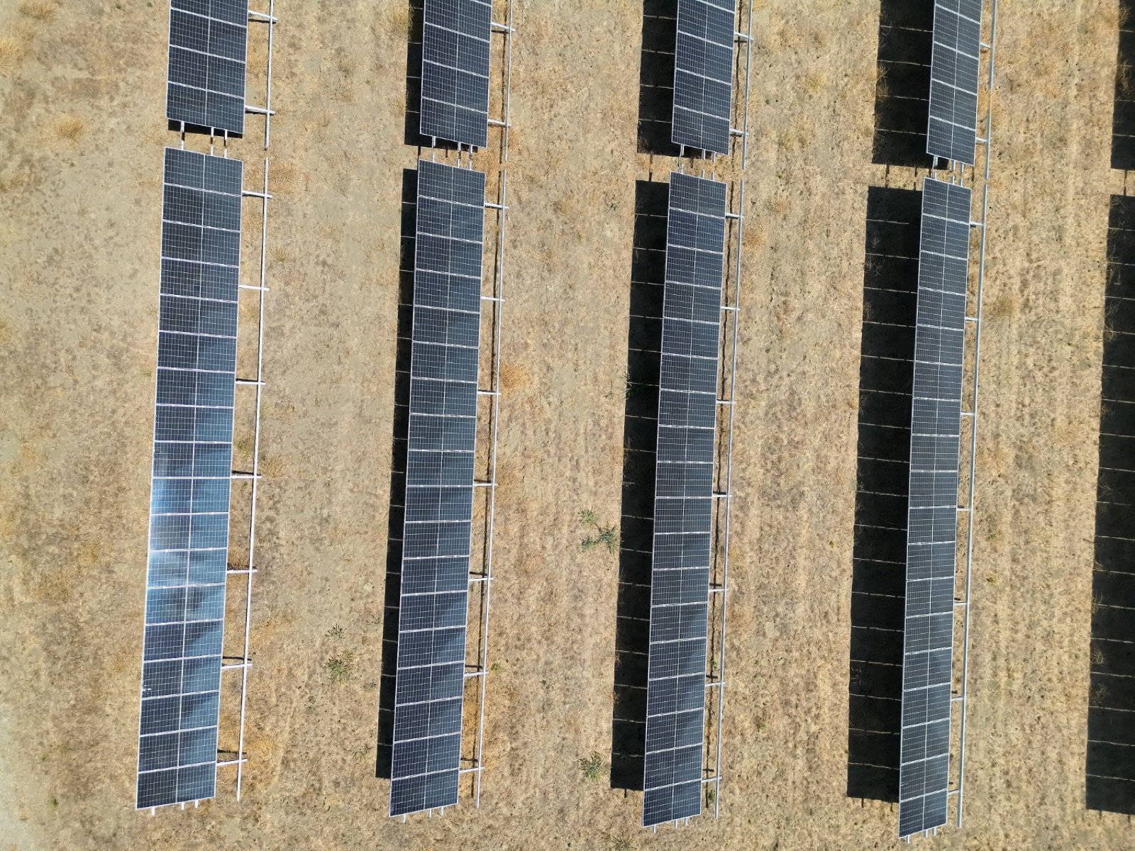 Aerial view of solar panel array rows for inspection